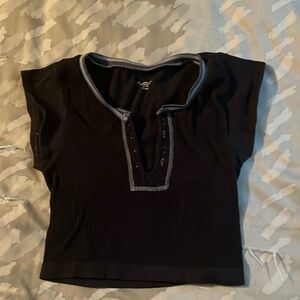 Out from under cropped shirt